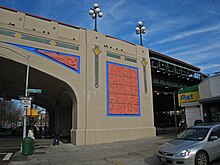 The facade of the Ocean Parkway subway station, which contains blue and salmon-colored tiles