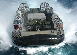 A hovercraft (LCAC = landing craft, air cushioned), used by the U.S. Navy.