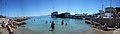 Panoramic image of the beach and harbor of Skala