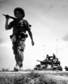 A French Foreign Legionnaire and a US gifted tank in the Red River Delta, between Haiphong and Hanoi, ca. 1954.