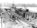 Construction of Wilson Dam taking place around 1919. Jackson Island, seen in the background, is now covered by Lake Wilson.