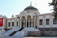 Exterior photo of a large building with a domed roof