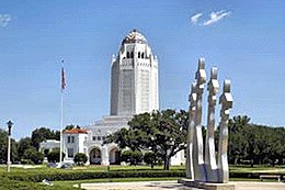 Sigillet för Joint Base San Antonio och administrationsbyggnaden på Randolph Air Force Base.