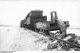 Rail plough being used to dismantle rail line in March 1944