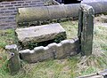 Remains of village stocks in St Mary's Churchyard