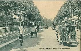 Carte postale ancienne d'un omnibus de la ligne E sur le boulevard Saint-Martin. Omnibus de la ligne E à la hauteur du boulevard Saint-Martin.