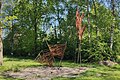 Sculpture grain stalks and baskets by Jan van der Meij