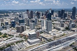 Victory Park in the foreground and the adjacent Uptown Dallas neighborhood with Downtown Dallas in the background (2021)