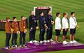 The podium for the men's team event, featuring the United States (left, silver), Italy (centre, gold), and South Korea (right, bronze)