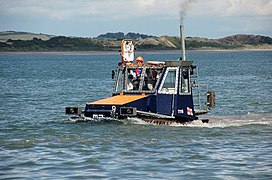 No, it's not a sinking boat. It rides on tracks. See also Sea-going tractors.