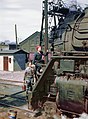 Women wipers of the Chicago and North Western Railroad cleaning one of the 4-8-4 "Northern" H-class steam locomotives, Clinton, Iowa, 1943