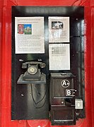 Original phone and coin box in a red telephone box