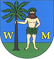 Kommunevåpenet til Bílé Podolí, Tsjekkia, har en villmann og et tre med grønnfargede elementer, begge opp fra en grønn «skjoldfot».