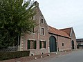 Hoeve in Scheulder aan de geasfalteerde weg