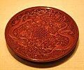 Ming dynasty red lacquerware dish with Chinese dragons and an endless knot