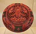 A Qing red lacquerware box with the Chinese character for "spring" inscribed on the front, dated to the Qianlong Emperor's reign (1736-1795)