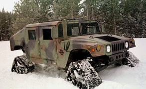 A Humvee, equipped with four separate tracks for snow mobility (U.S. Army).