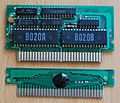 Cartridge boards without cases, the top one is an earlier version with integrated memory chips