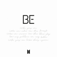 On a white background, the word "BE" in capital letters. Below, text in cursive writing reads "Life goes on/Like an echo in the forest/Like an arrow in the blue sky/On my pillow, on my table/Life goes on like this again".