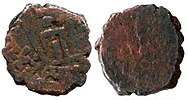 Coin of Sodasa, satrap of Mathura, AE. Obv: Lakshmi standing between two symbols on the obverse and inscription around "Mahakhatapasa putasa Khatapasa Sodasasa ". Rev: Standing Abhiseka Lakshmi anointed by two elephants.