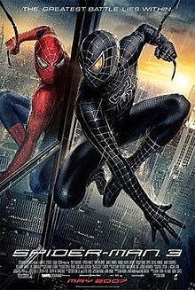 Spider-Man in the rain in his black suit looks at himself in a mirror wearing the original suit, with the film's slogan, title, release and credits below.