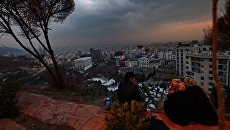 Вид на вечерний Тегеран. Иран. Архивное фото Вид на вечерний Тегеран. Иран. Архивное фото