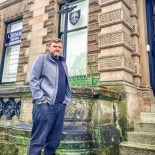 Article thumbnail: Parent Douglas Marks outside Cedars School in Greenock, which is shutting down (photo: Stephen Jewell)