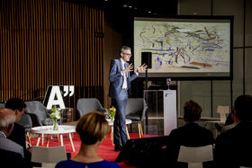 Aalto Vision Forum keynote speaker giving inspiring talk