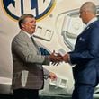 Georgia head coach Kirby Smart, left, and Southeastern Conference commissioner Greg Sankey shake hands at SEC NCAA college football media days in Dallas Tuesday, July 16, 2024. (Hunter Dawkins/The Gazebo Gazette via AP)