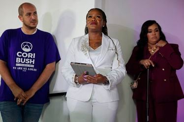 U.S. Rep. Cori Bush, center, waits to be introduced to supporters on Tuesday, Aug. 6, 2024, before acknowledging her defeat at a watch party at Chevre Events in downtown St. Louis. (Christian Gooden/St. Louis Post-Dispatch via AP)