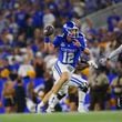 Kentucky Wildcats quarterback Brock Vandagriff (12) looks for a receiver while on the run in a game against the Southern Miss Eagles on August 31, 2024, at Kroger Field in Lexington, KY. (Photo by Jeff Moreland/Icon Sportswire) (Icon Sportswire via AP Images)