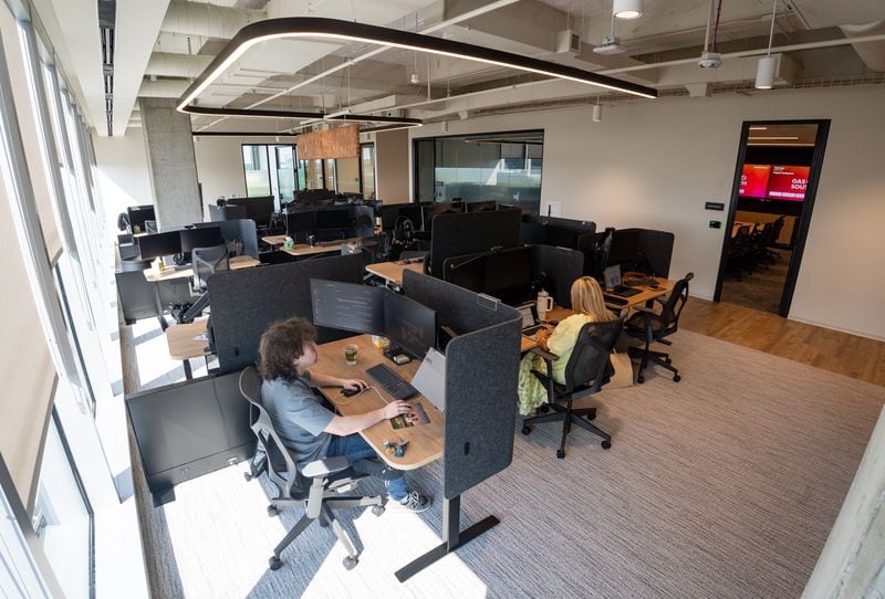 Employees work at Gas South's new corporate headquarters in Cobb County on Aug. 8, 2024. (Seeger Gray / AJC)