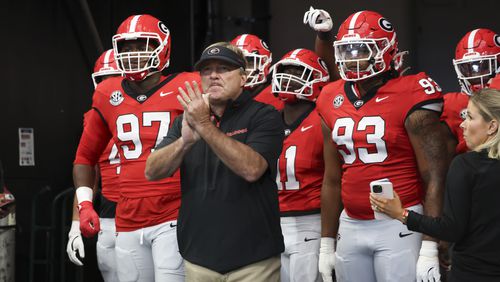 Georgia head coach Kirby Smart walks with defensive lineman Warren Brinson (97), wide receiver Arian Smith (11) and defensive lineman Tyrion Ingram-Dawkins (93) before their game against Clemson at Mercedes-Benz Stadium, on Saturday, Aug. 31, 2024, in Atlanta. (Jason Getz / AJC)
