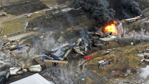 FILE - In this photo taken with a drone, portions of a Norfolk Southern freight train that derailed the previous night in East Palestine, Ohio, remain on fire at mid-day, Feb. 4, 2023. (AP Photo/Gene J. Puskar, File)