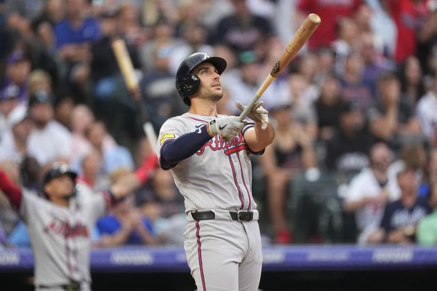 Atlanta Braves' Matt Olson watches the flight of his grand slam off Colorado Rockies starting pitcher Dakota Hudson, not pictured, in the third inning of a baseball game Saturday, Aug. 10, 2024, in Denver. The Braves won 11-8.  (AP Photo/David Zalubowski)