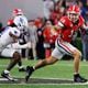 Bulldogs tight end Brock Bowers (19) runs after a catch during the team's 2023 matchup against Kentucky in Athens.  (Bob Andres for the Atlanta Journal Constitution)