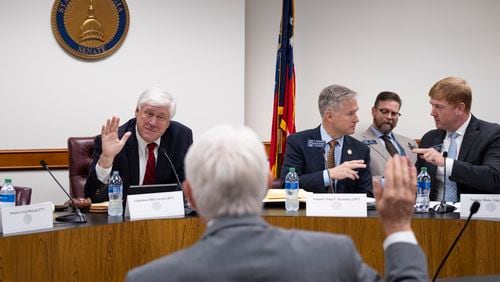 Sen. Bill Cowsert (R-Athens), chairman of the Senate Select Committee on Investigations, swears in David Cook, the former secretary of the Senate, during a meeting of the committee Friday, Sept. 13, 2024, at the State Capitol.   Ben Gray for the Atlanta Journal-Constitution