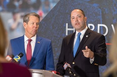 Gov. Brian Kemp, left, and state Attorney General Chris Carr spoke Friday to GOP activists at The Gathering, the annual conservative conference that Erick Erickson puts on. Each talked about former President Donald Trump's attacks against them as distractions that aren't helping Republicans focus on what they need to do during this year's presidential campaign. (Arvin Temkar / arvin.temkar@ajc.com)