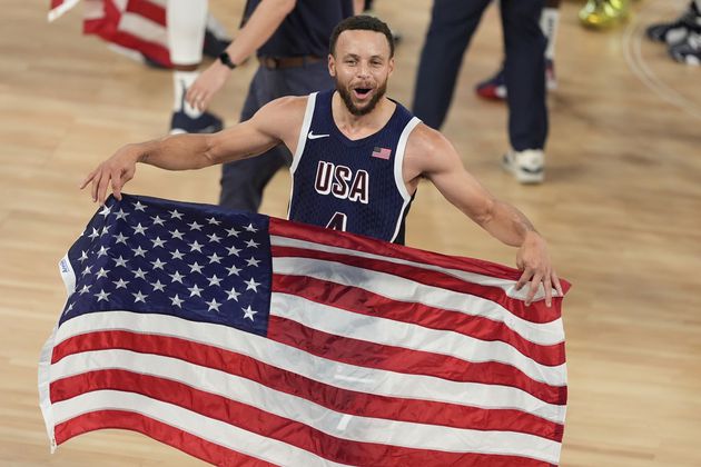 The United States had a big day at the Paris Olympics Saturday, winning gold medals in basketball, soccer and track, plus medals in other sports. Take a look at the celebration, starting with Stephen Curry rejoicing after leading the U.S. past France in basketball for the gold. (AP Photo/Michael Conroy)