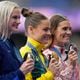 Women's pole-vault silver medalist, Katie Moon, left, from Powder Springs in metro Atlanta, stands with gold medalist Nina Kennedy, centre, of Australia, and bronze medalist, Alysha Newman, of Canada, on the podium at the 2024 Summer Olympics, Thursday, Aug. 8, 2024, in Saint-Denis, France. (AP Photo/Natacha Pisarenko)