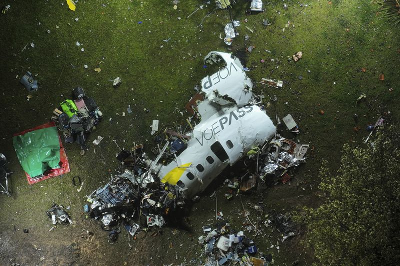 The debris at the site where an airplane crashed with 61 people on board, in Vinhedo, Sao Paulo state, Brazil, early on Saturday, Aug. 10, 2024. Brazilian authorities are working to piece together what exactly caused the plane crash in Sao Paulo state the previous day, killing all 61 people aboard. (AP Photo/Andre Penner)