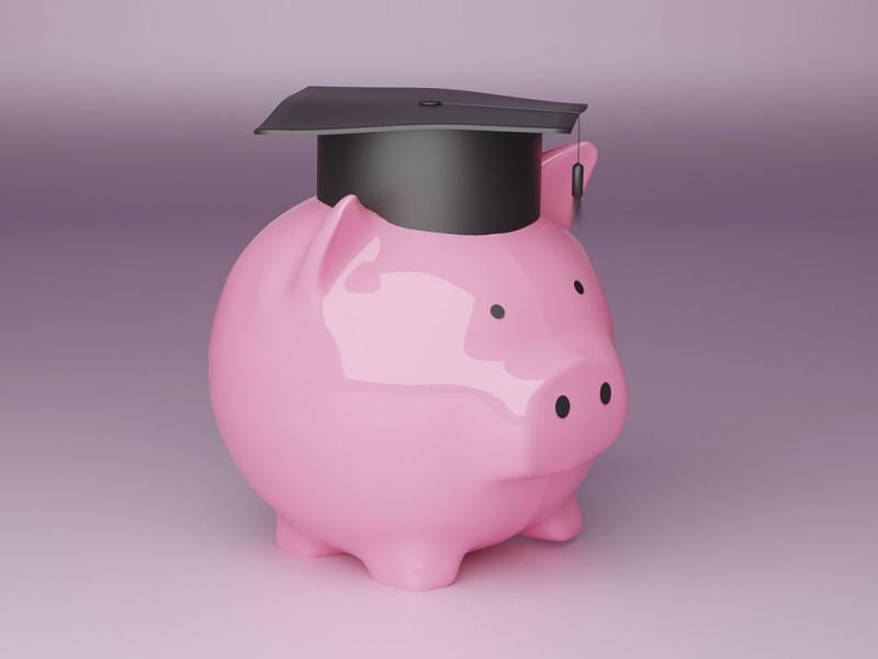 Piggy bank wearing a graduation cap