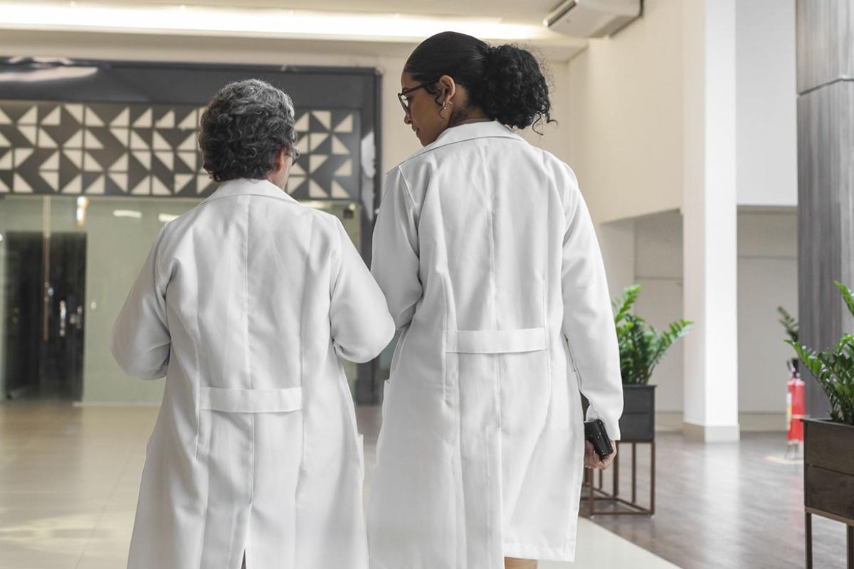 Two doctors talking in a hallway