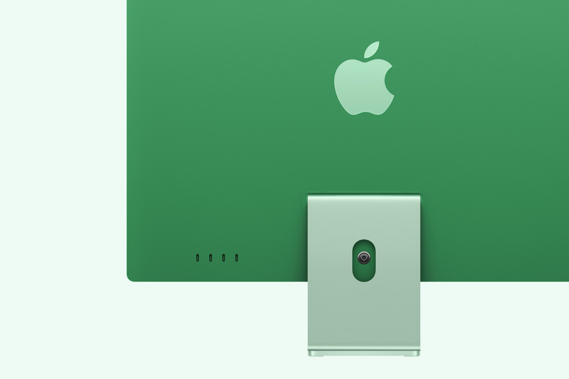 Achteraanzicht van een groene iMac, met vier USB‑C-poorten.