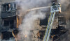 Firefighters tackle a blaze after a Russian aerial bomb struck a multi-story residential building in Kharkiv, Ukraine, Sunday.