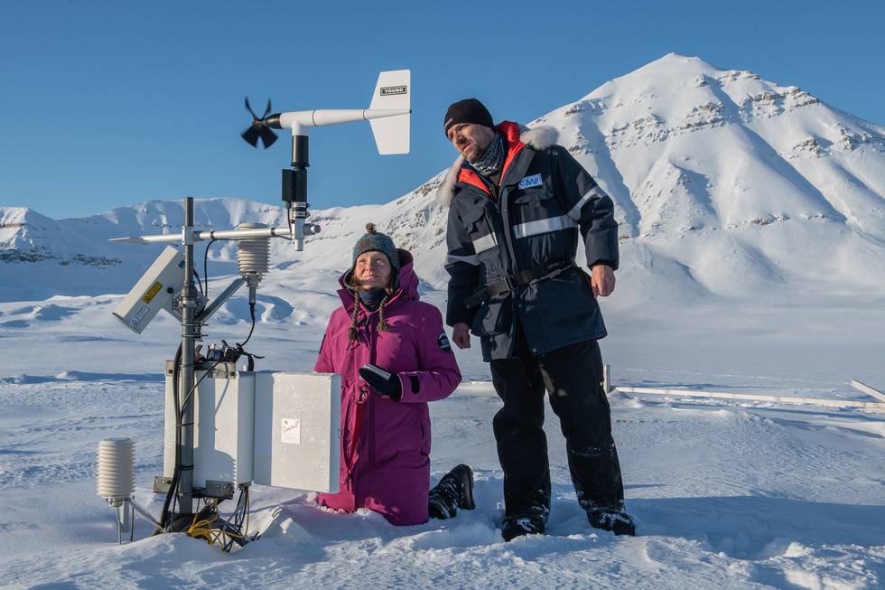 Julia Boike, permafrost researcher, and Bill Cable, engineer, check instruments at the Bayelva long-term permafrost observatory.