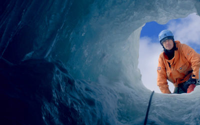 Looking up to a BAS Field assistant through a deep hole in the ice