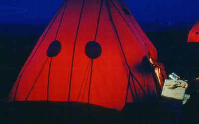 Orange tents in the dark