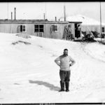 A man that is standing in the snow