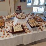 A table with several plates of food on top